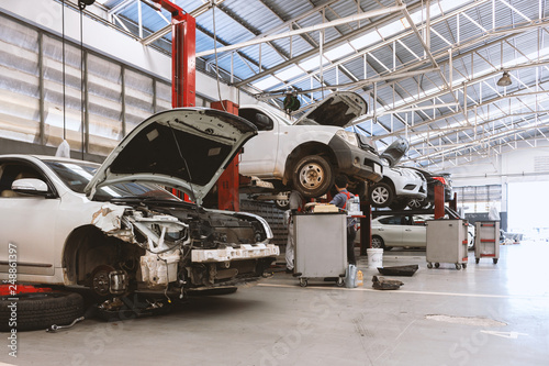 closeup car in repair station and body shop with soft-focus and over light in the background