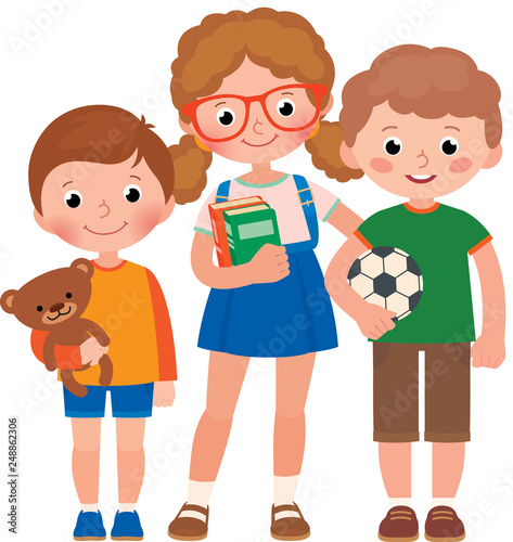 Three children, a little boys and a girl, pupils of elementary school or a preschool with a schoolbag, books and a toy