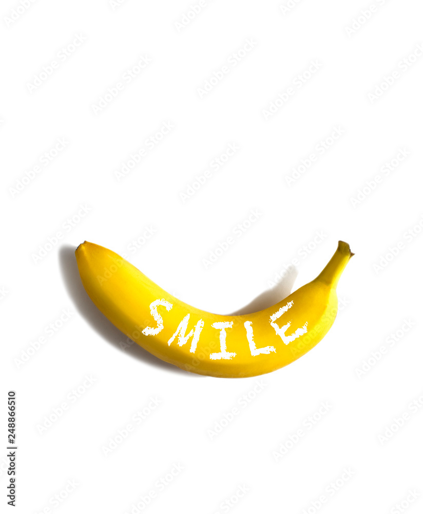 Ripe banana with word Smile on white background, flatlay, copy space