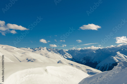 Ski run Davos Switzerland sunny snowy landscape with panoramic top view © U_WD