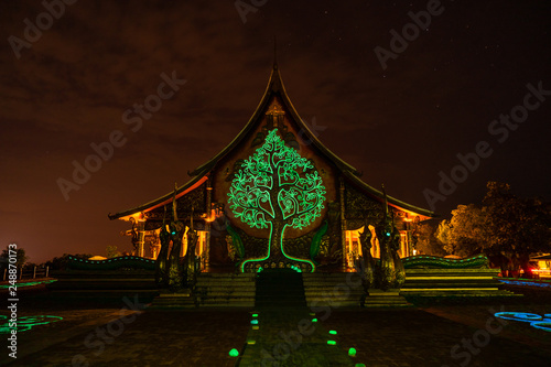Sirindhorn Wararam or Phu Phrao Temple. The temple is glittering at night and is located in Ubon Ratchathani, Thailand.