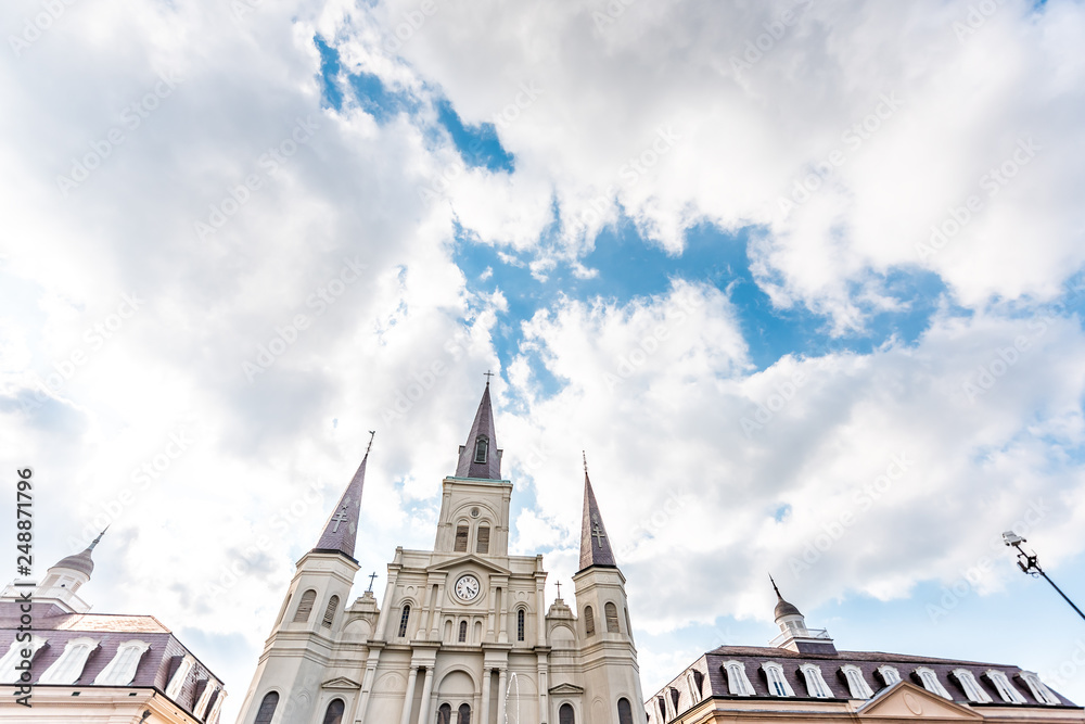 Fototapeta premium New Orleans, USA Old town street in Louisiana famous town city with St Louis cathedral church during sunny day on Jackson Square looking up cityscape