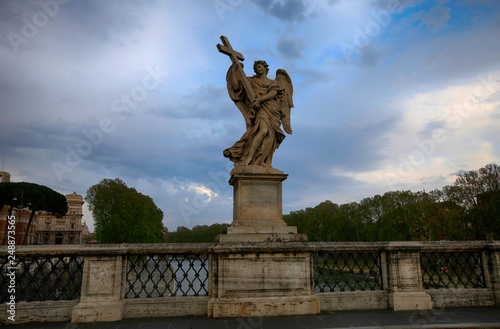 Statue on the Saint Angelo bridge over the Tiber river in Rome, Italy