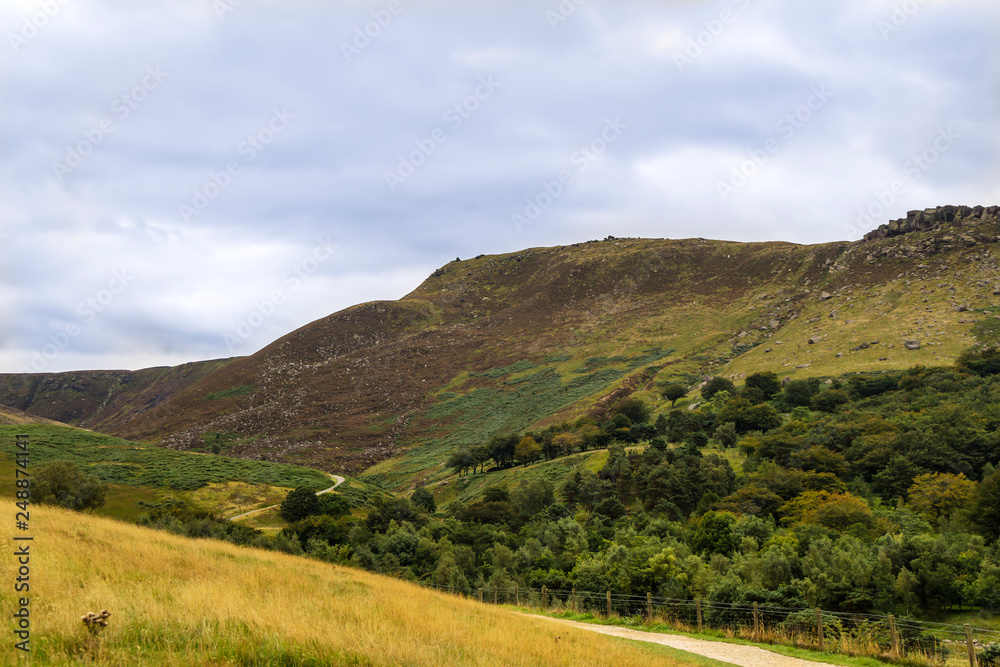  Rural landscape with steep limestone valleys at the Peak District National Park is in central England. 