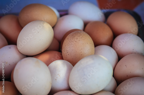 Close up white and brown chicken eggs background. Boiled or grilled eggs for sale on the street in Bangkok, Thailand.