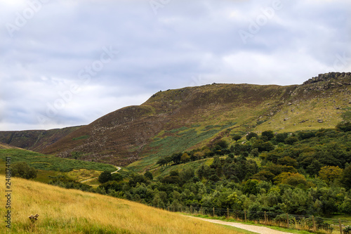  Rural landscape with steep limestone valleys at the Peak District National Park is in central England. 