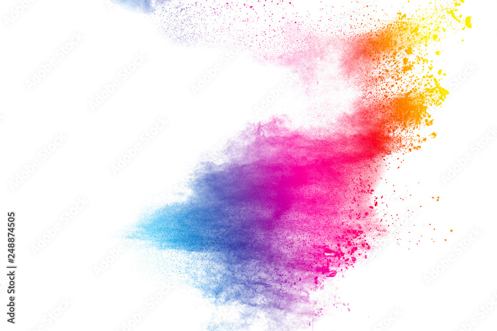 Abstract multi color powder explosion on white background.  Freeze motion of  dust  particles splashing. Painted Holi in festival.
