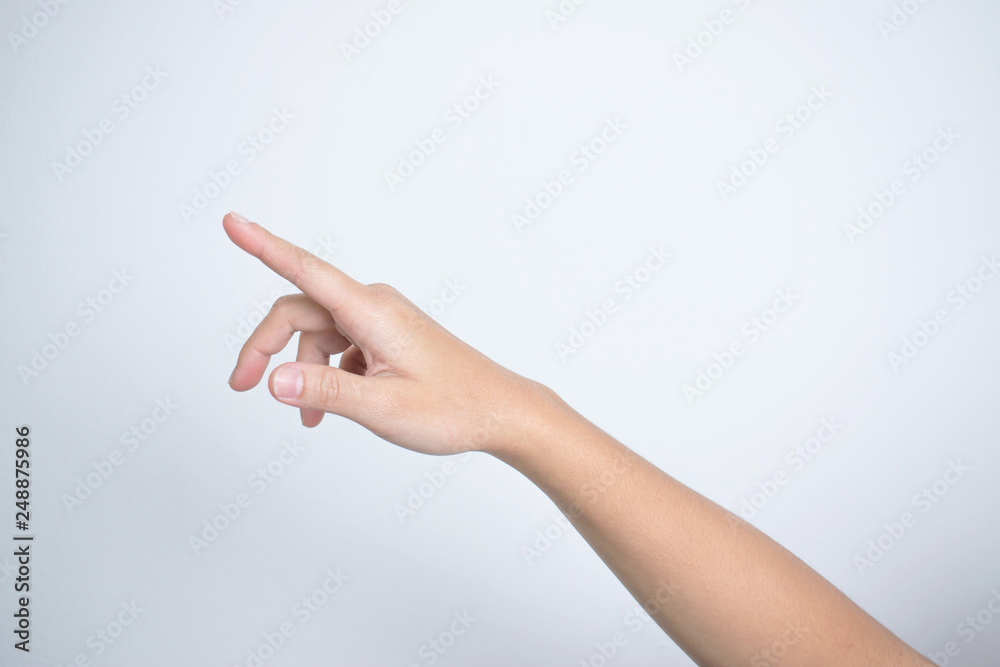 The image of the hand pointing to the white background on the side. Hand isolated.