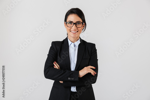 Fotografia Portrait of successful businesswoman 30s in formal wear and eyeglasses standing