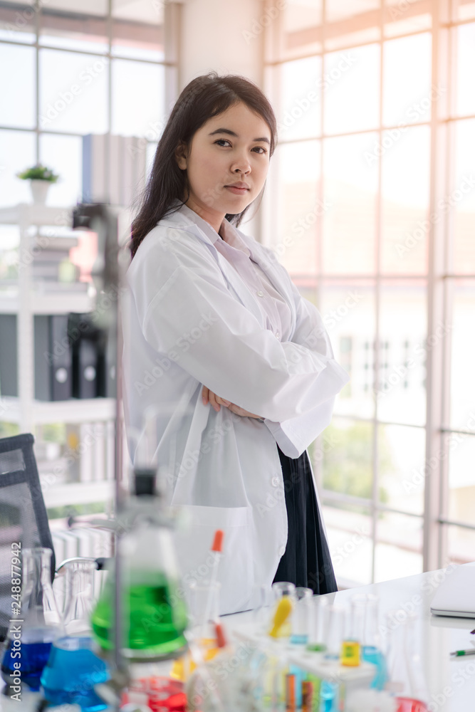 Portrait of Asian scientist in science room.. Portrait of Asian scientist in science room..