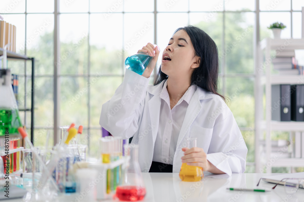 Portrait of Asian scientist in science room.. Portrait of Asian scientist in science room..