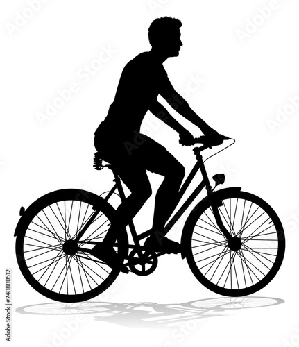 A bicycle riding bike cyclist in silhouette