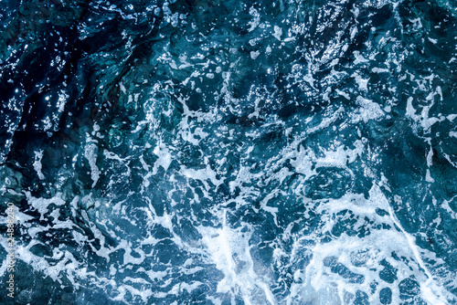 Blue deep sea foaming water background