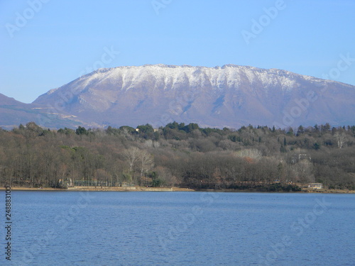 View of snowcapped Dajti mountain with Tirana's main park and artificial lake in the foreground, Albania photo