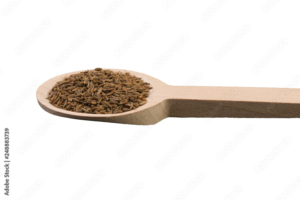 caraway seeds on wooden spoon isolated on white background caraway seeds on wooden spoon isolated on white background