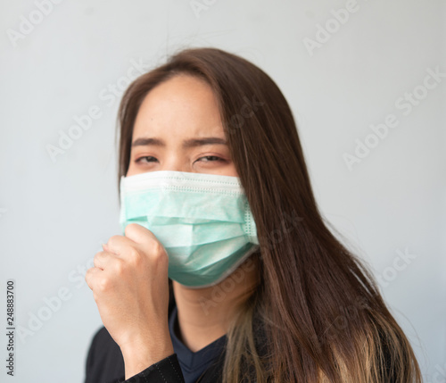 Women wearing dust masks Use the hand to display anti-symbols and prohibit ready to stop © Phimchanok