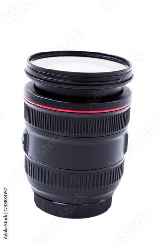 Camera lens isolated on white background. Camera photo lens, vertical image. Professional photography device.
