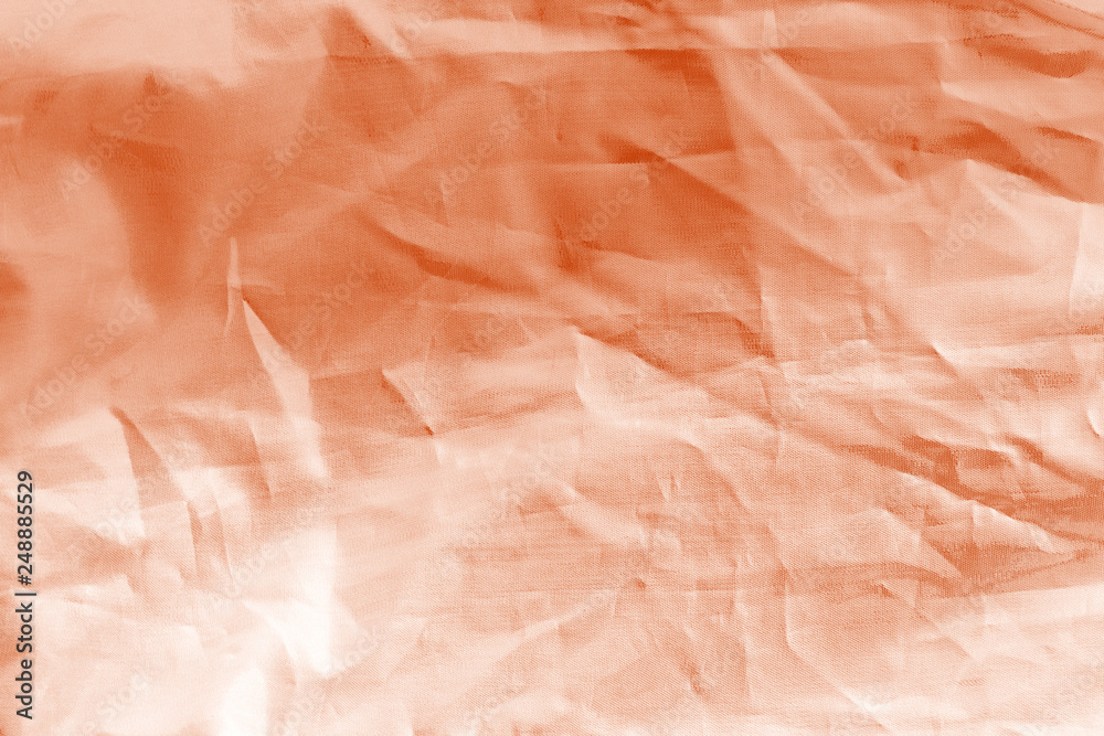 Fototapeta premium Elegant orange textile background. Silk cloth texture. Fabric pattern.