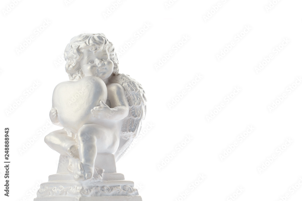 Fototapeta premium Cherub statue isolated on white background. Angel holds the heart. Love