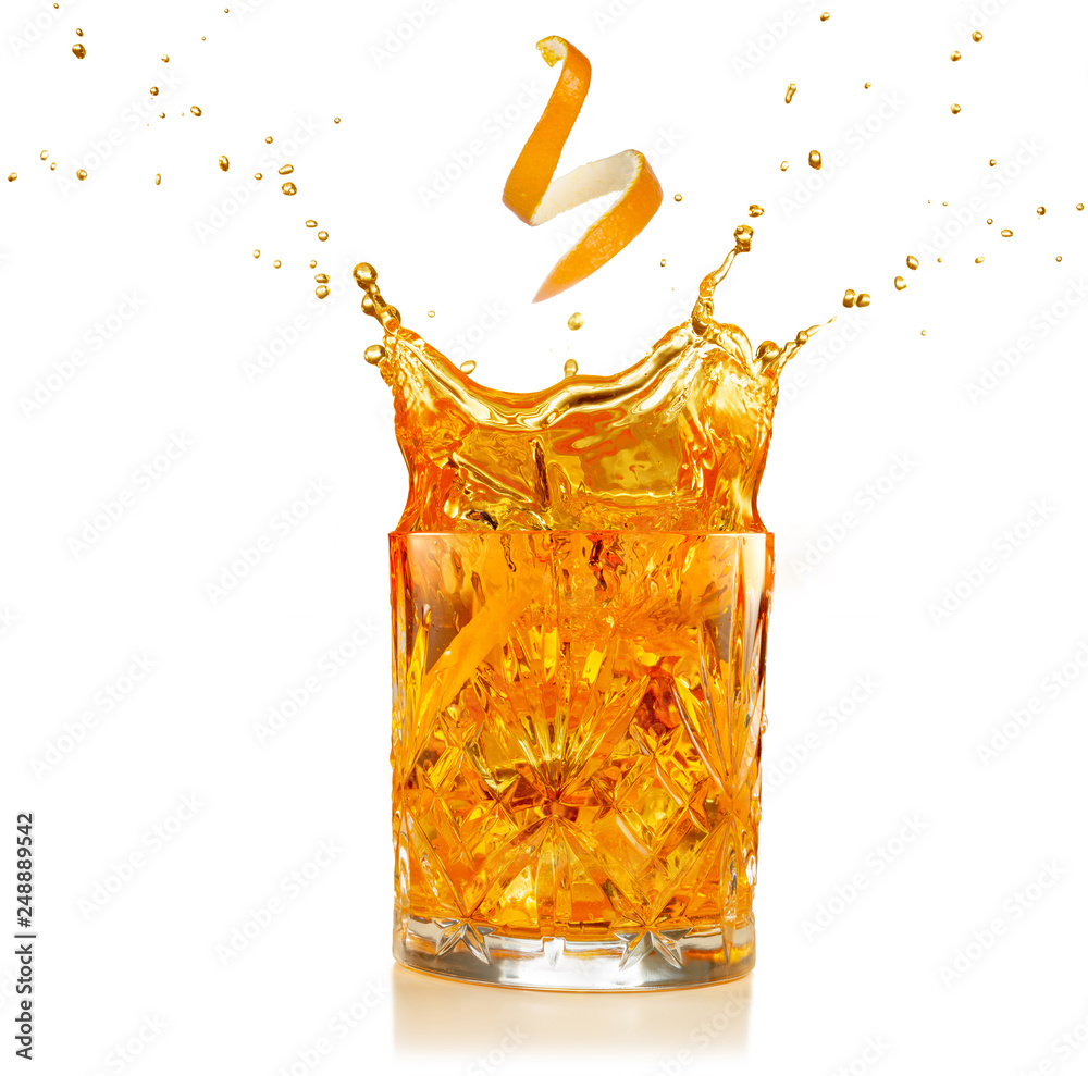 orange zest falling into a splashing cocktail isolated on white - obrazy, fototapety, plakaty 