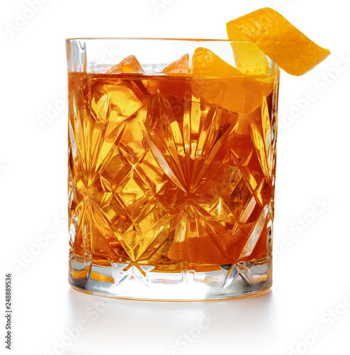 old fashioned cocktail garnished with orange twist peel isolated photo