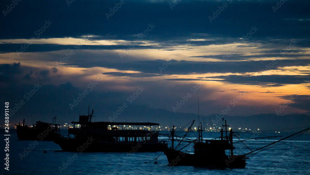 Fototapeta premium The Boat on sea with sunrise.
