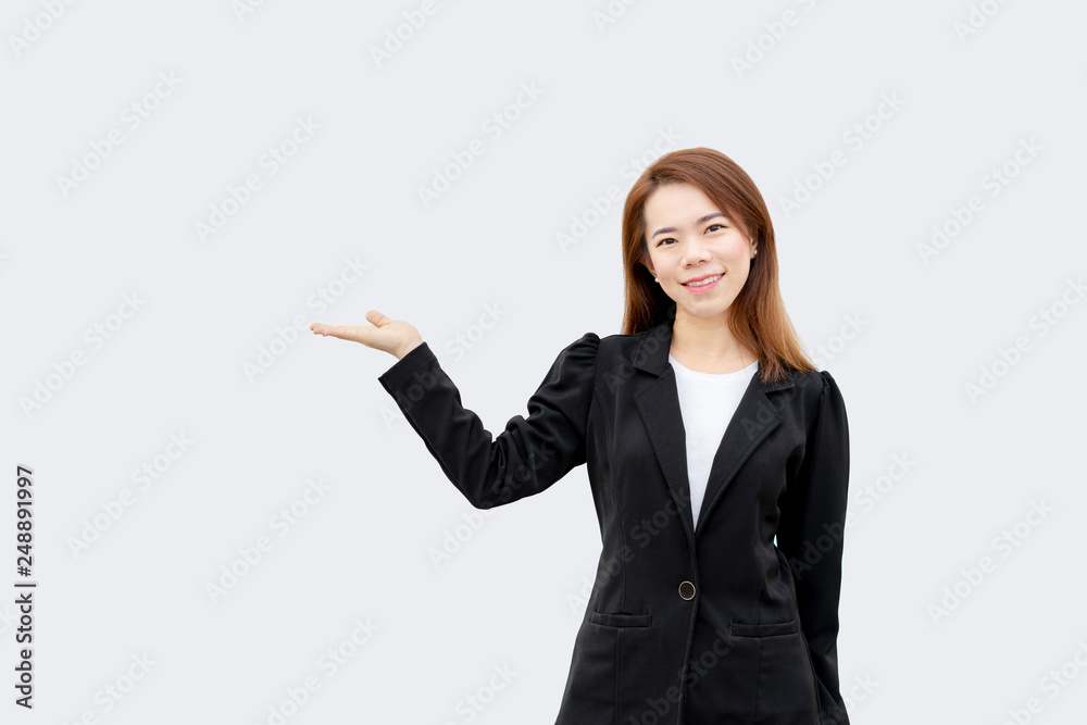 asian business woman presenting hand with long hair in black suit isolated on white color background asian business woman presenting hand with long hair in black suit isolated on white color background