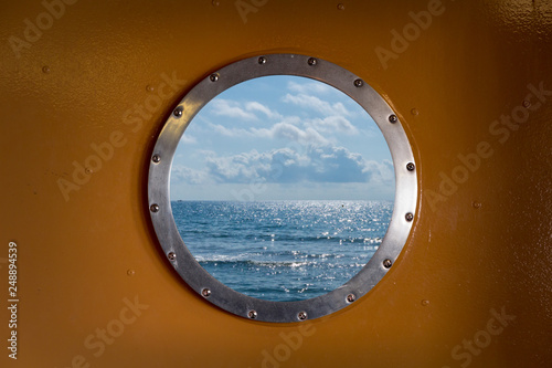 porthole or window with sea and horizon