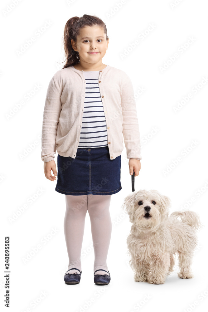 Little girl with her dog smiling at the camera