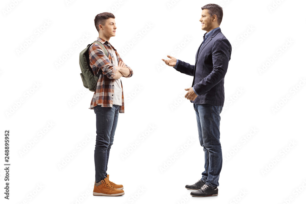 Young boy listening to a man talking