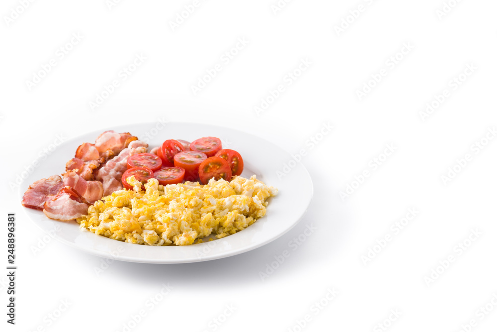Breakfast with scrambled eggs, bacon and tomatoes isolated on white background. Copyspace Breakfast with scrambled eggs, bacon and tomatoes isolated on white background. Copyspace