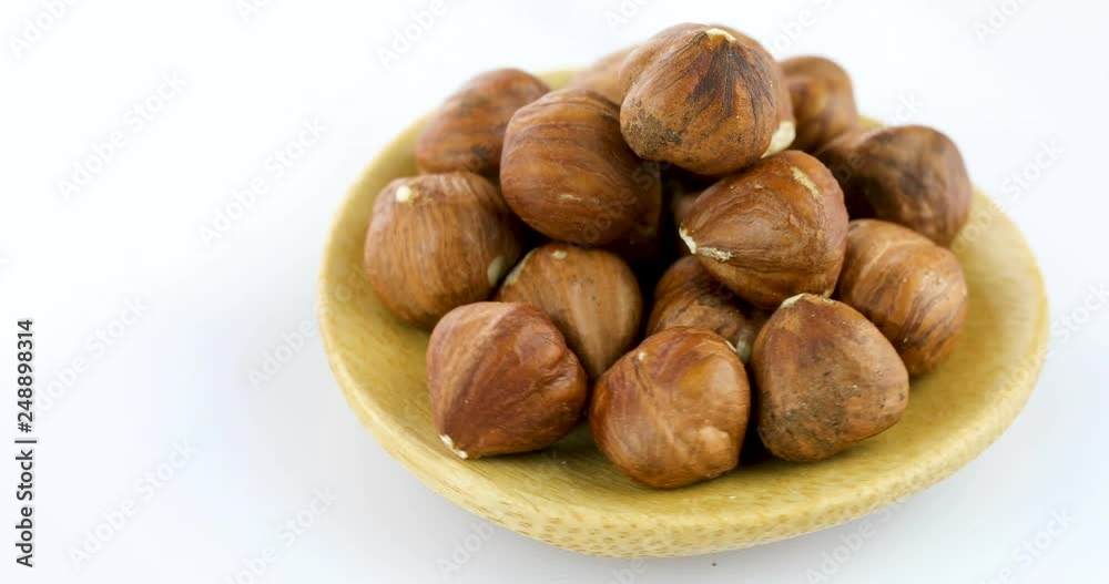 raw hazelnuts isolated on white background raw hazelnuts isolated on white background