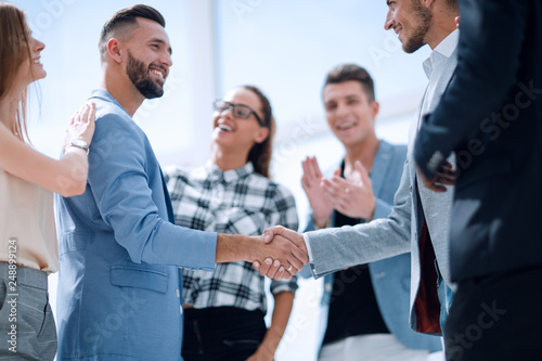 An attractive, diverse business team meeting as a grou