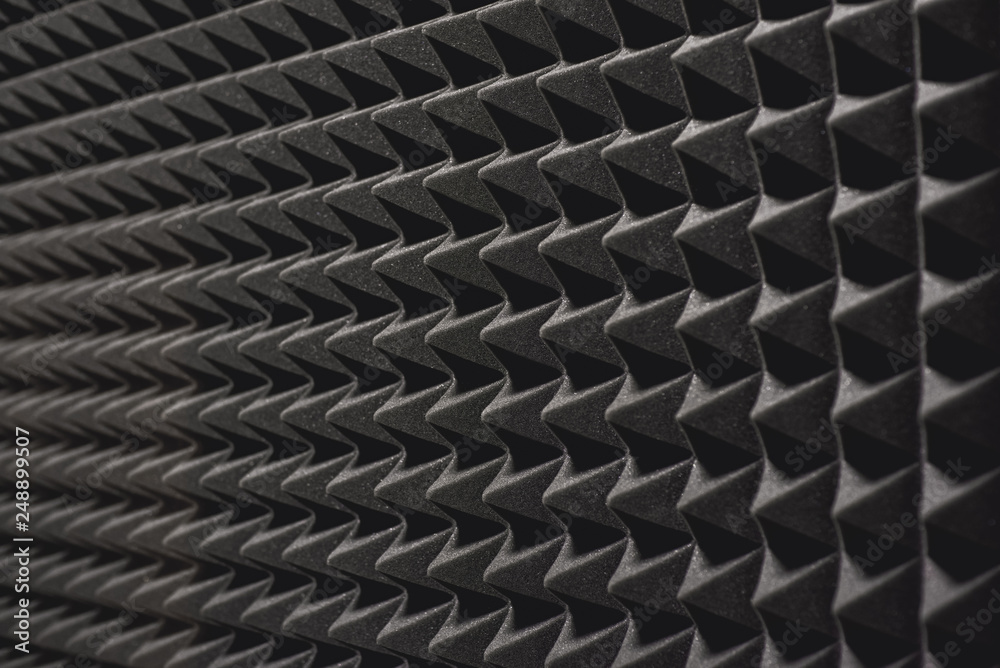 Nobody will hear you. Close up view of a grey soundproof coverage on the wall in music studio.
