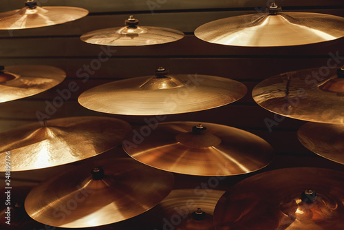 Visiting musical instrument store. Different types of drum cymbals for your ideal drum set. Music concept. photo