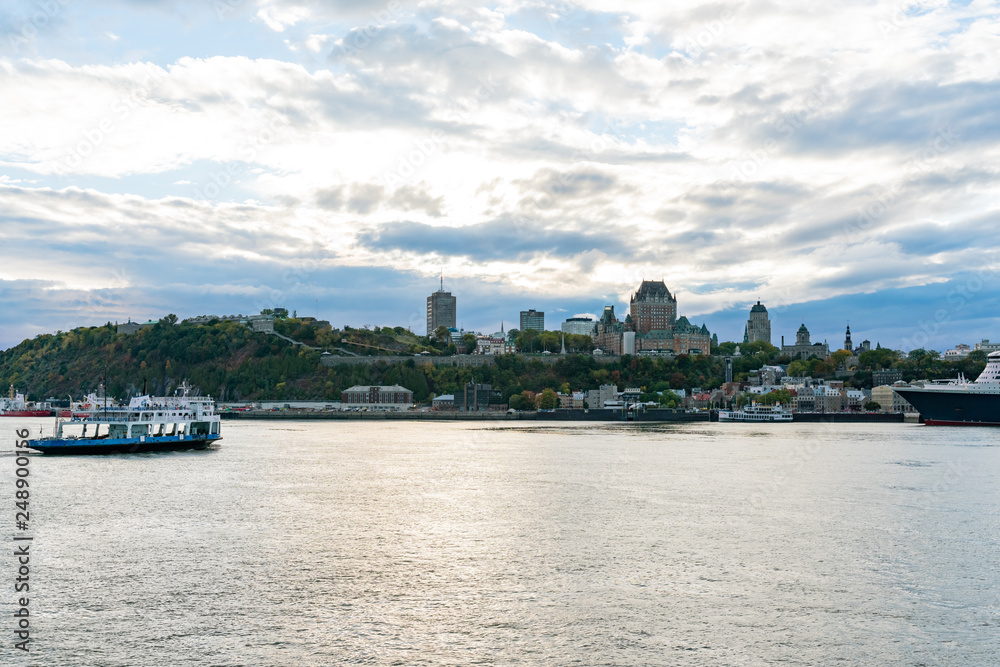 Sunset view of the Quebec city skyline with Fairmont Le Château Frontenac, ferry