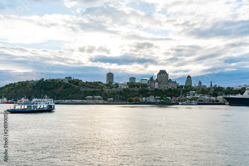 Sunset view of the Quebec city skyline with Fairmont Le Château Frontenac, ferry