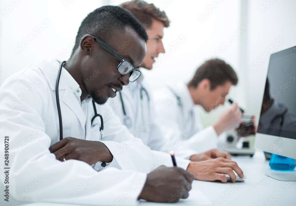 group of doctors sitting in the laboratory group of doctors sitting in the laboratory