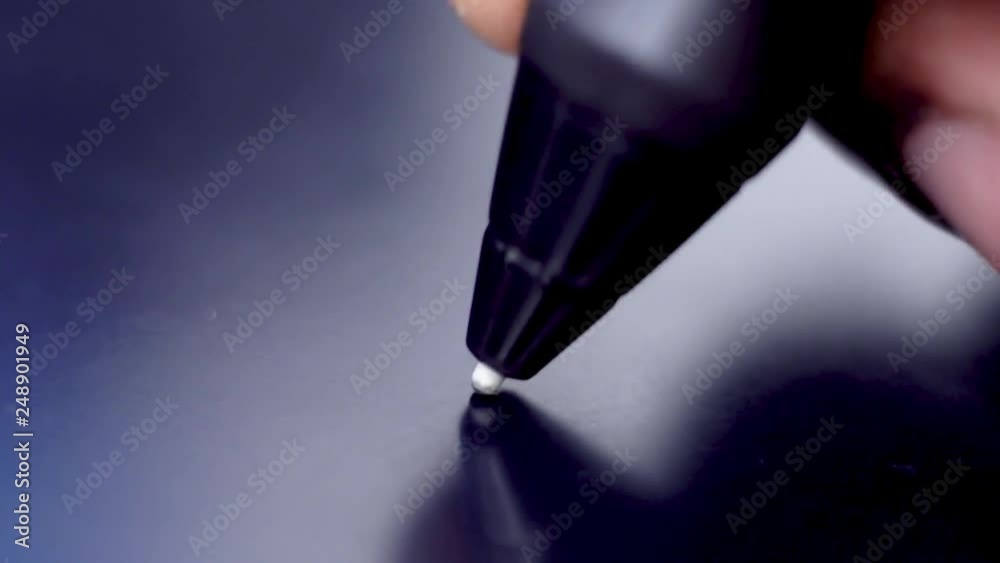 black hand drawing on stylus tablet to create amazing art.  macro shot of tech savvy innovator creating amazing designs on graphic tablets