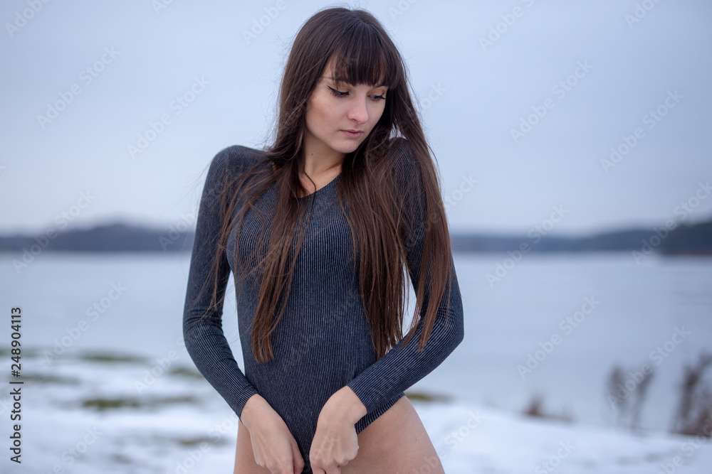 Pretty girl outdoor winter portrait on the ice lake Pretty girl outdoor winter portrait on the ice lake