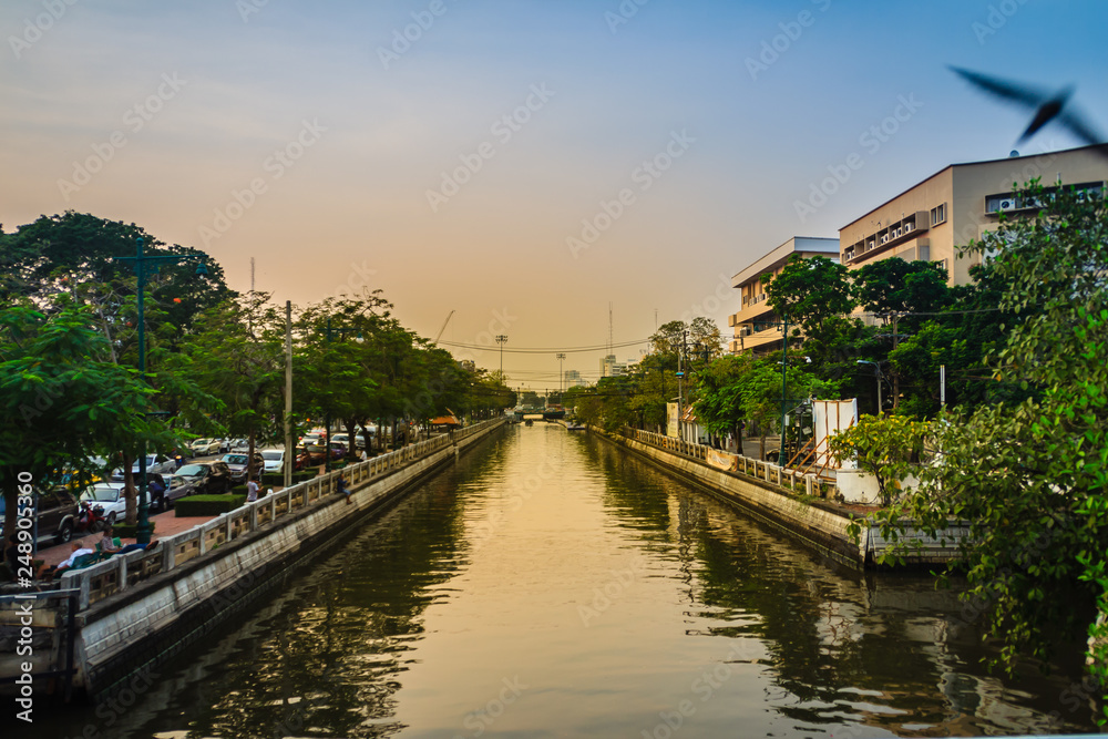 View of Klong Phadung Krung Kasem, the canal dug in 1851 in order to serve as a new outer moat for the expanding city. Evening at Khlong Phadung Krung Kasem, canal in Bangkok Thailand