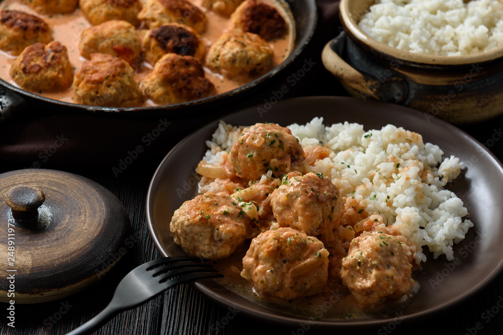 Turkey meatballs in tomato sauce with mascarpone served with boiled rice. Turkey meatballs in tomato sauce with mascarpone served with boiled rice.