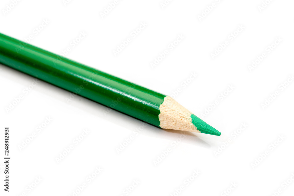 Green pencil close-up isolated on white background. Stationery. Back to school. Lesson. Education. Painting. Green pencil close-up isolated on white background. Stationery. Back to school. Lesson. Education. Painting.