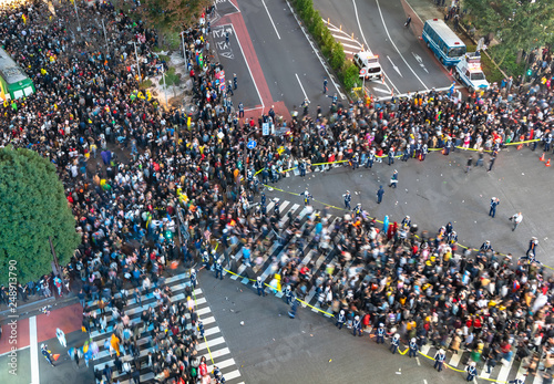 Unbelievable crowd of people in shibuya district during halloween celebration. Halloween has become a massive hit in Tokyo in recent years. photo