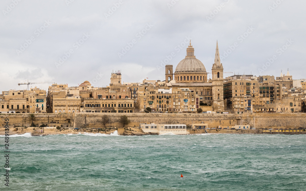 Panoramic View on the Skyline of historical Valletta during a stormy day. Valletta, Malta, Europe