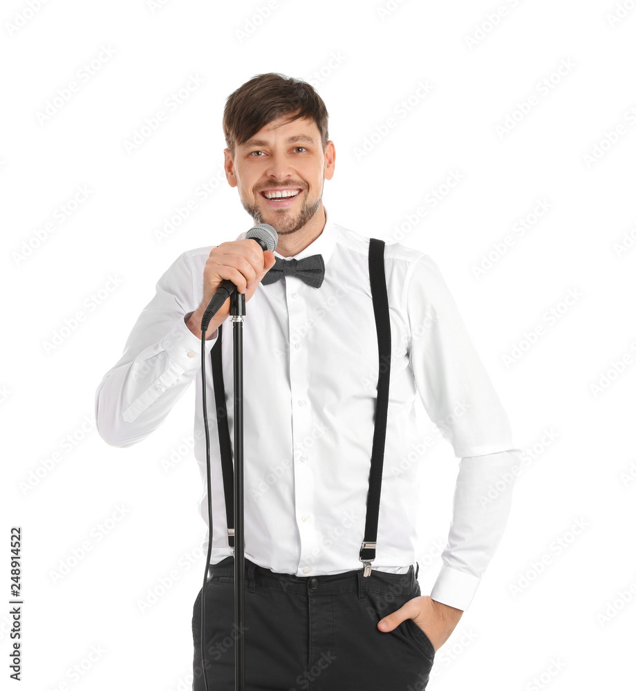 Handsome man in formal clothes posing with microphone on white background Handsome man in formal clothes posing with microphone on white background