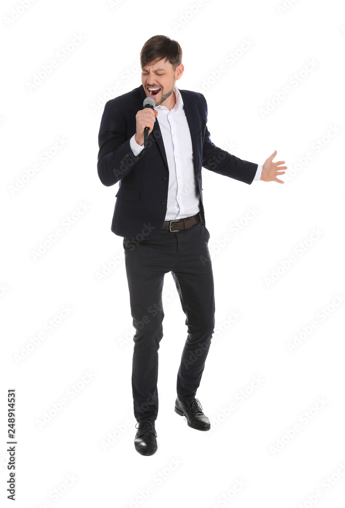 Handsome man in suit singing with microphone on white background Handsome man in suit singing with microphone on white background