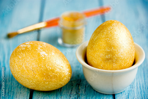 Golden Easter eggs, preparation for easter holidays photo