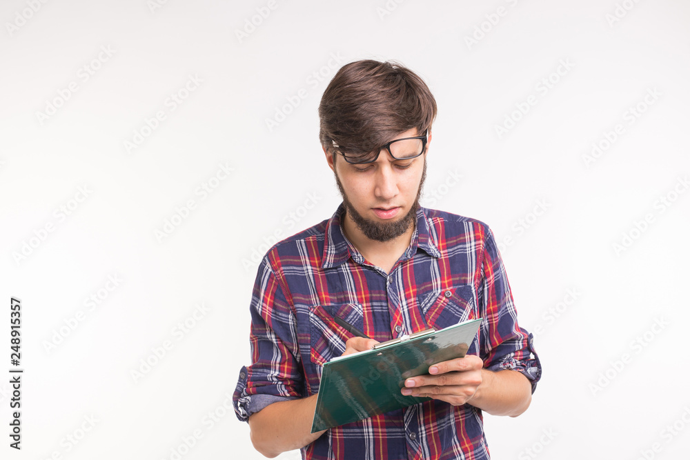 people, working and joke concept - Funny handsome bearded man with clipboard on white background people, working and joke concept - Funny handsome bearded man with clipboard on white background