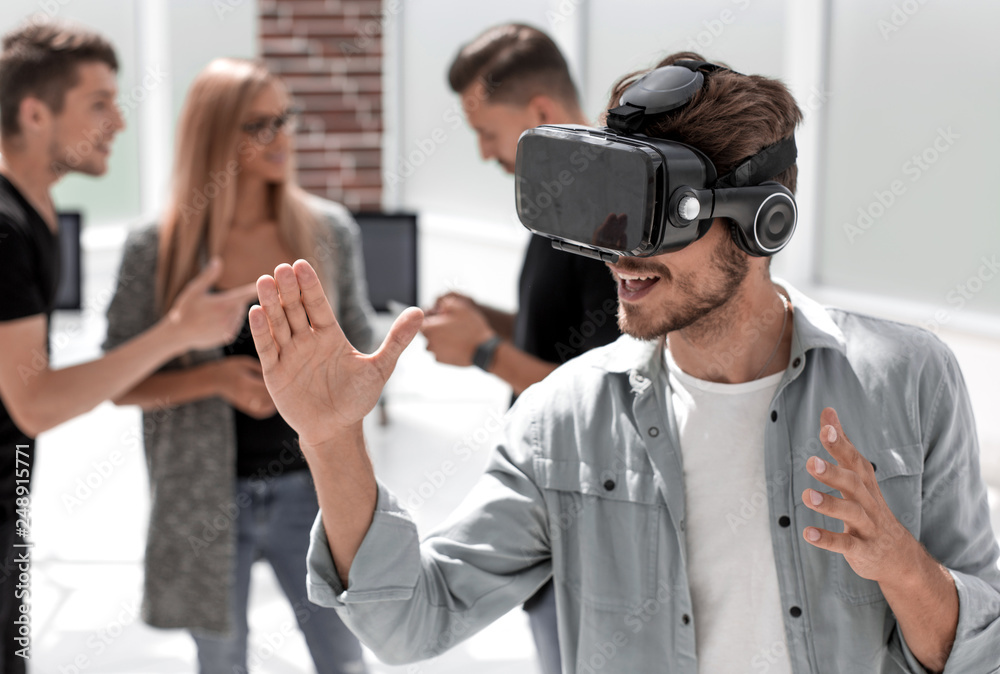 Young men with virtual reality goggles Young men with virtual reality goggles